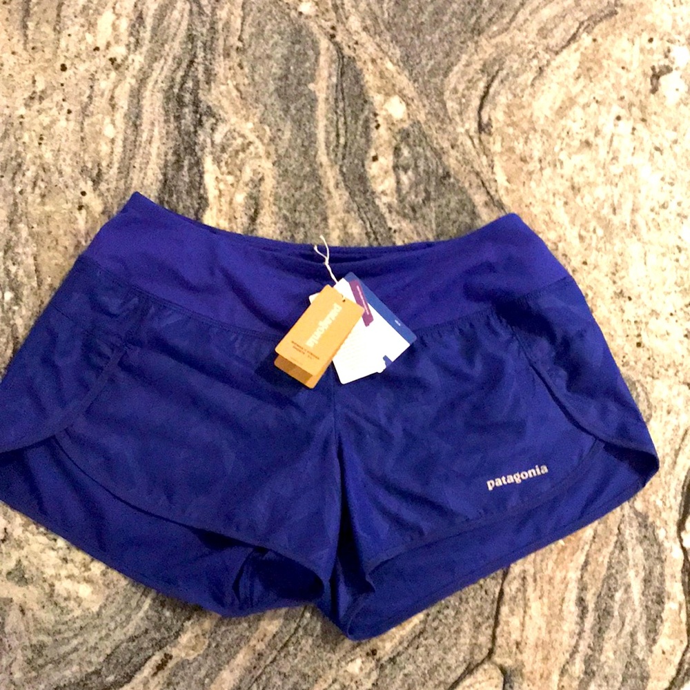 Patagonia New with tags woman’s small Strider cobalt blue running shorts! Nice